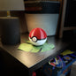 Original Style Pokeball Nintendo Switch Game Case sitting closed on a table.